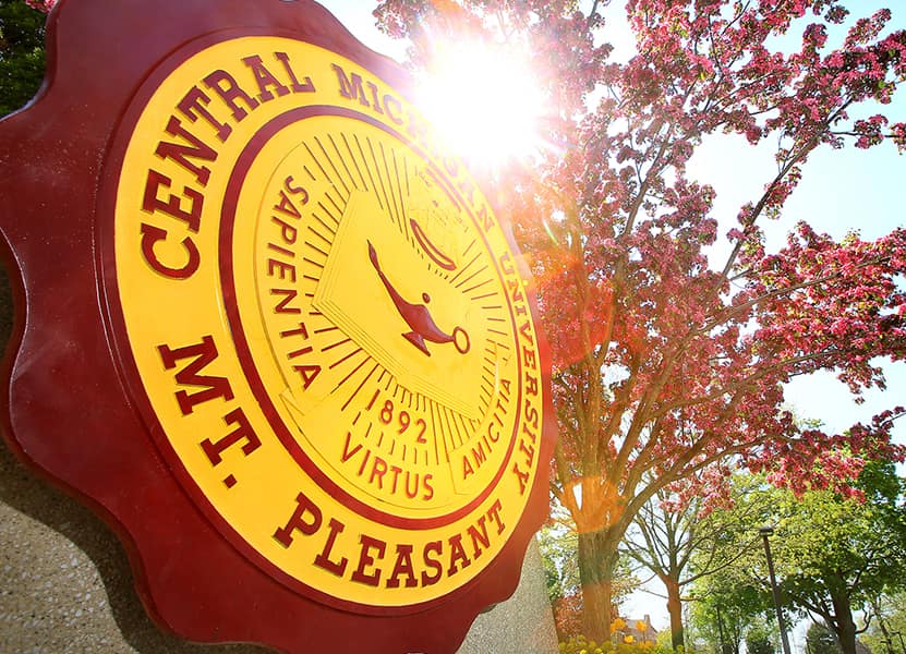 20210723_Support_UniversitySeal_008 maroon and gold CMU seal with a tree in the background