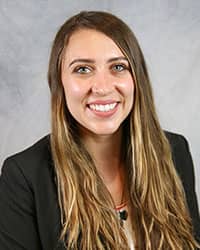 Headshot of Kayla Orbeck wearing a black blazer.