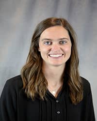 Headshot for Mara McMurray wearing a black top.