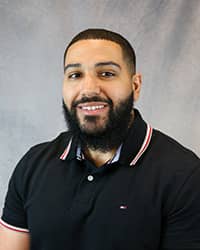 Headshot of Shereef Zaky wearing a black polo shirt.