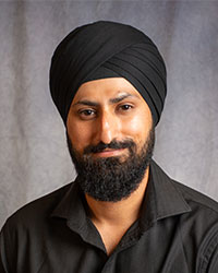 Atinderpal Kainth is wearing a black shirt and black turban