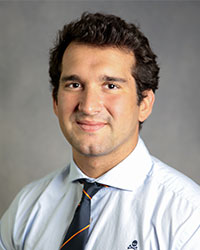 Emilio Lopez-Burgos is in a white shirt and tie