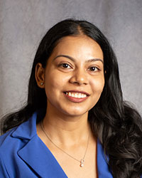 Singh, Pavan Pavan Singh is wearing a blue blouse.