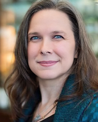 Headshot of Colleen Newvine. She's wearing a dark teal jacket.