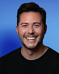 Headshot of Joel Lecz on a bright blue backdrop.