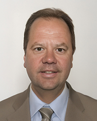 Headshot of Matt Dobek with a white backdrop.