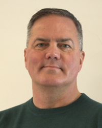 Headshot of Randy Lovely in front of an off-white backdrop