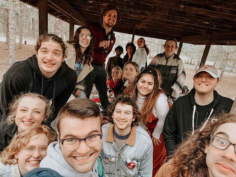 The Alpha Psi Omega group taking a selfie outside.
