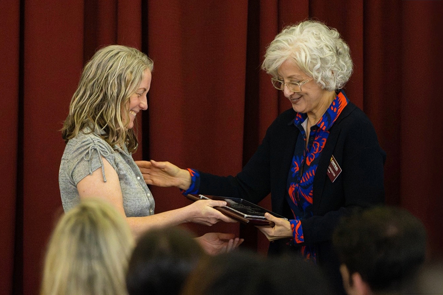 a woman receiving an award another woman