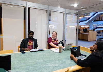 Students sitting at a table in the Park Library.