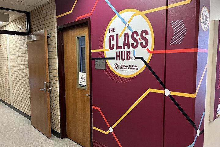 Entrance to the CLASS Hub with a maroon wall and colorful lines