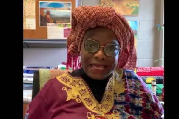Maureen Eke sits at her desk
