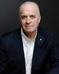 Closeup image of Dan Kildee wearing a dark suit and white shirt
