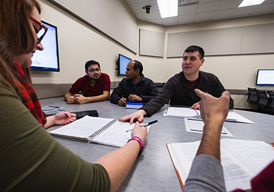 Mathematics students having a discussion at an active learning station.