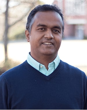 a man in a blue sweater