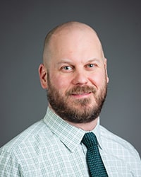 Head and shoulders photo of John Andraka, assistant professor in the Physical Therapy Department.