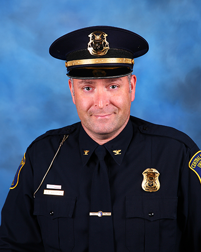 Chief of Police Cameron Wassman sitting for a photo 