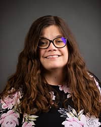 Kate Caszatt, Counseling Center Counselor - wearing pink and black floral shirt for profile image