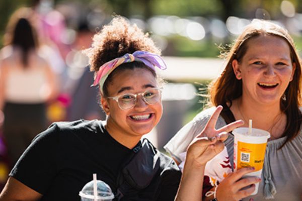 Weeks of Welcome Image Two Central Michigan University students smile for the camera during Weeks of Welcome.