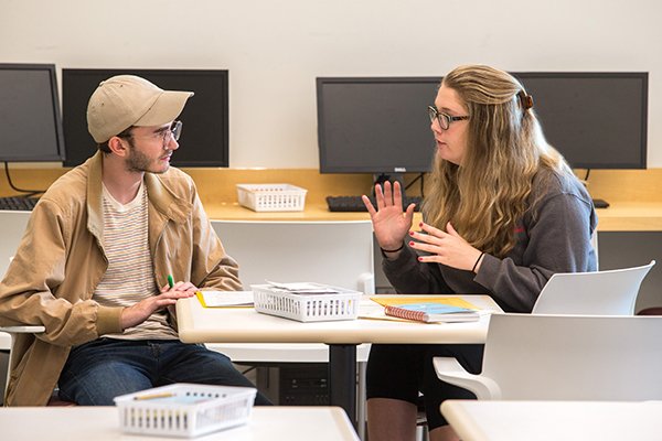 2017-333-53 writing Center Park Library sj Two students talking at a table