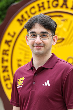 JoeWahbeh A photo of Supplemental Instruction Assistant Program Supervisor, Joe Wahbeh, in front of the CMU seal on Warriner Mall