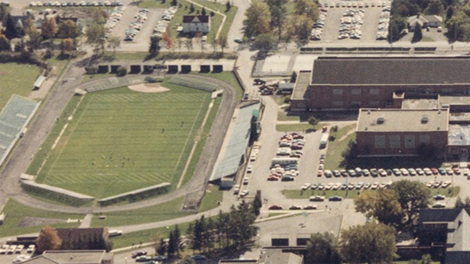 aerial view of a sports field next to buildings