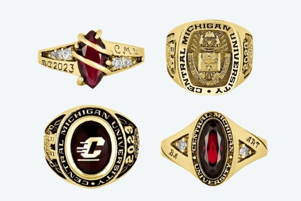 A display of four different gold Central Michigan University class ring designs, each featuring the university name.