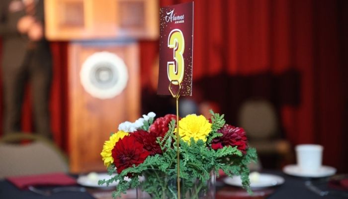 Flower centerpiece with number 3 table number